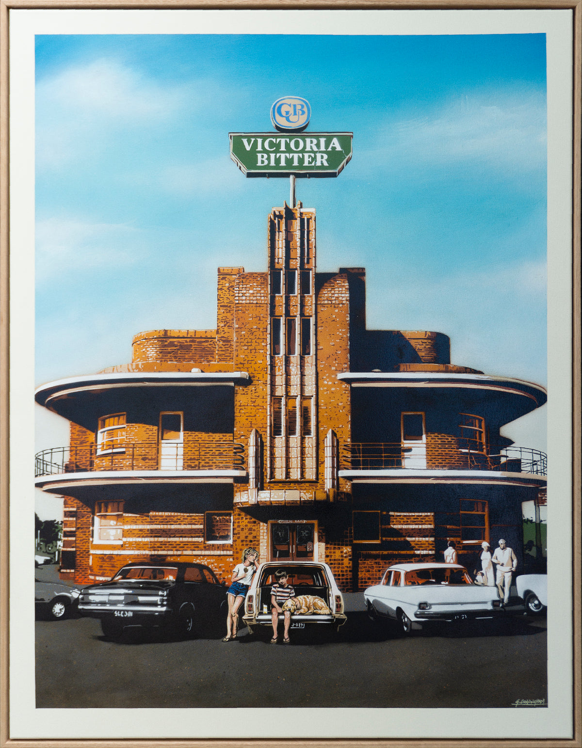 A framed aoriginal stencil painting depicting a retro brick building with a green 'Victoria Bitter' sign, set against a blue sky, with vintage cars and people in front. 