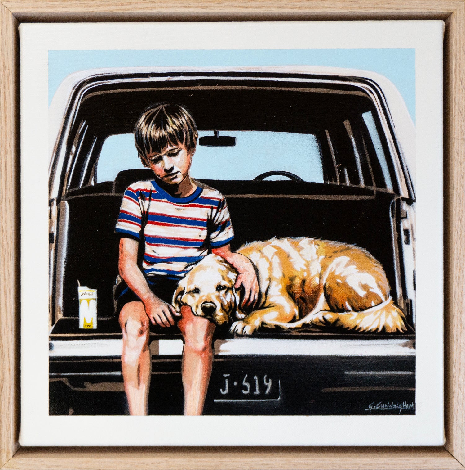 a boy and his dog wait in the family car
