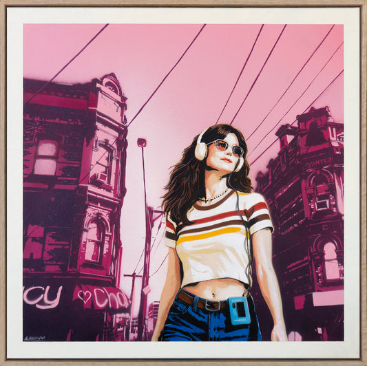 Framed artwork of a person with headphones against a stylized cityscape background.