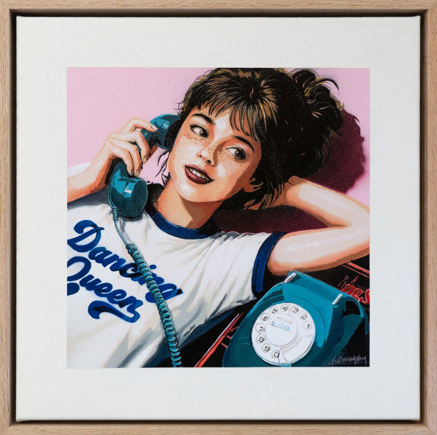 a girl talking on an old rotary telephone