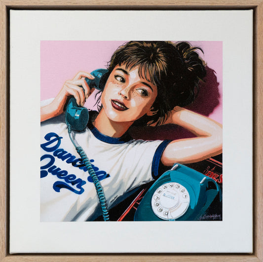 a girl talking on an old rotary telephone