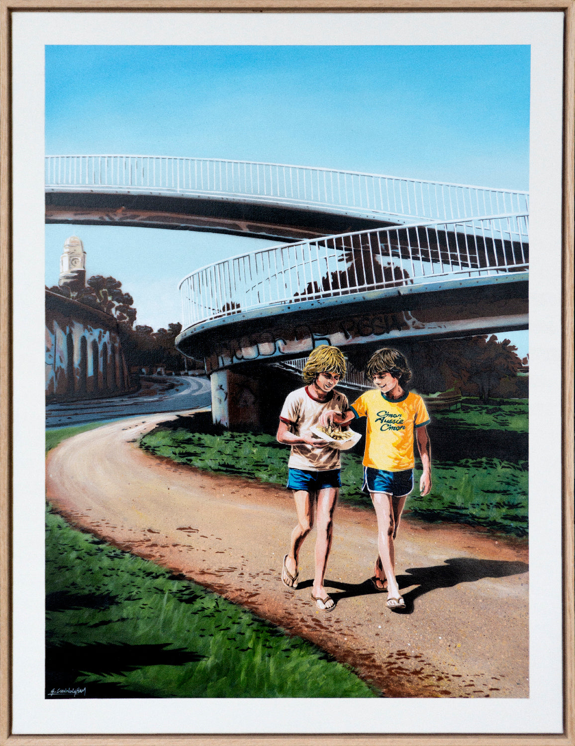 two boys eating hot chips whilst walking near the beach