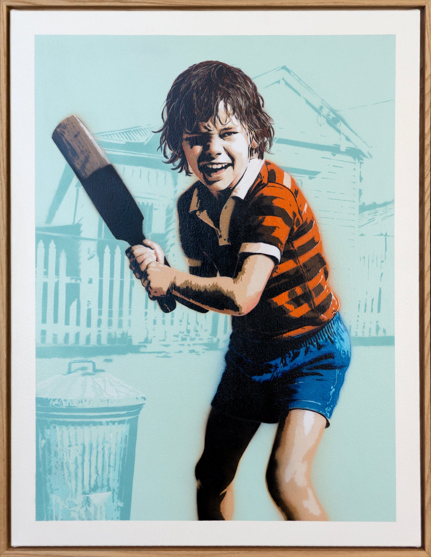 Framed artwork of a child playing street cricket with a bat