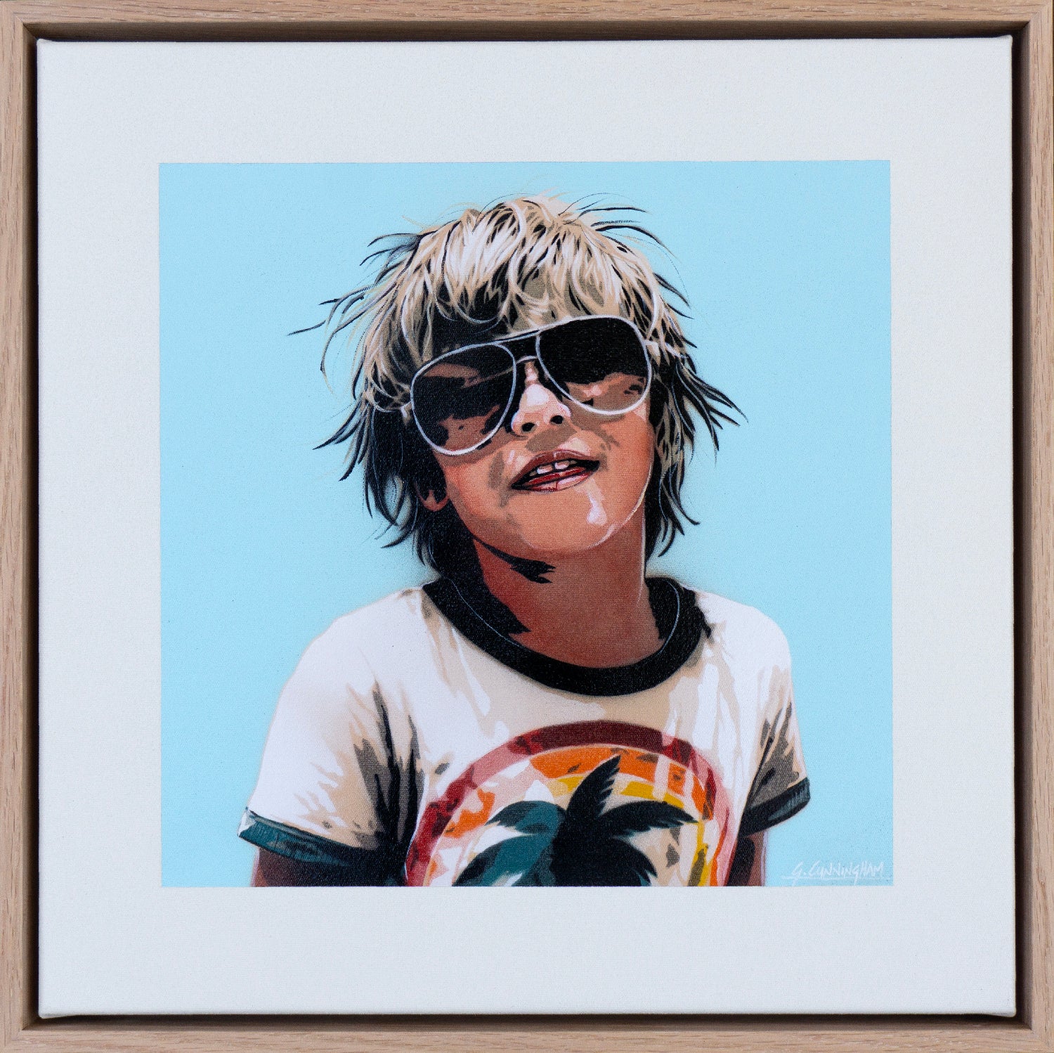 Framed artwork of a scruffy but cool child wearing sunglasses with a blue background